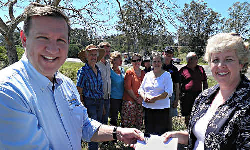 Member for Gympie David Gibson accepts the petition calling for a highway speed reduction from Anne Maddern on behalf of concerned Curra residents. Member for Gympie David Gibson accepts the petition calling for a highway speed reduction from Anne Maddern on behalf of concerned Curra residents.